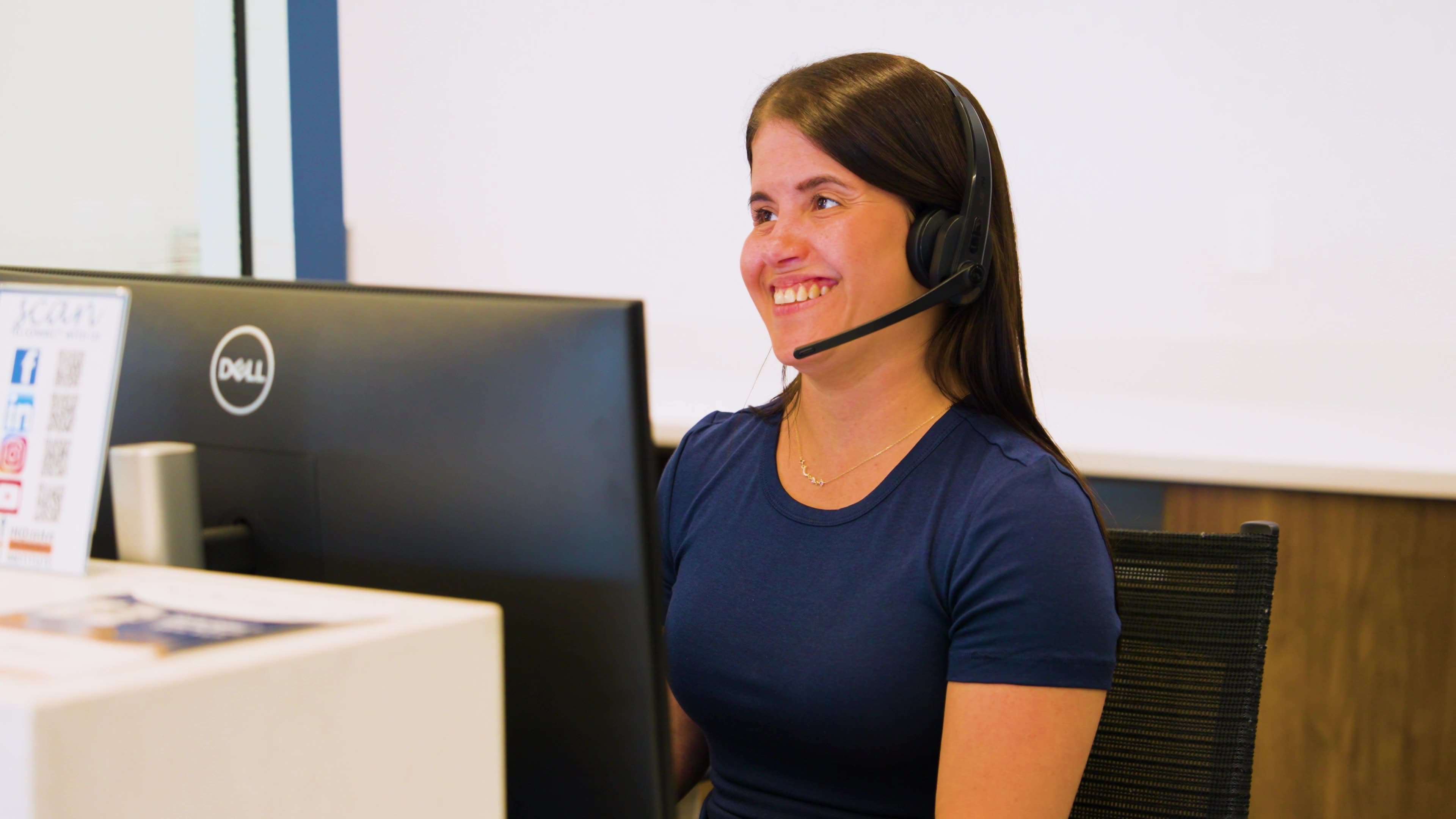 Indiana Orthopedic Institute team member assisting a patient by phone