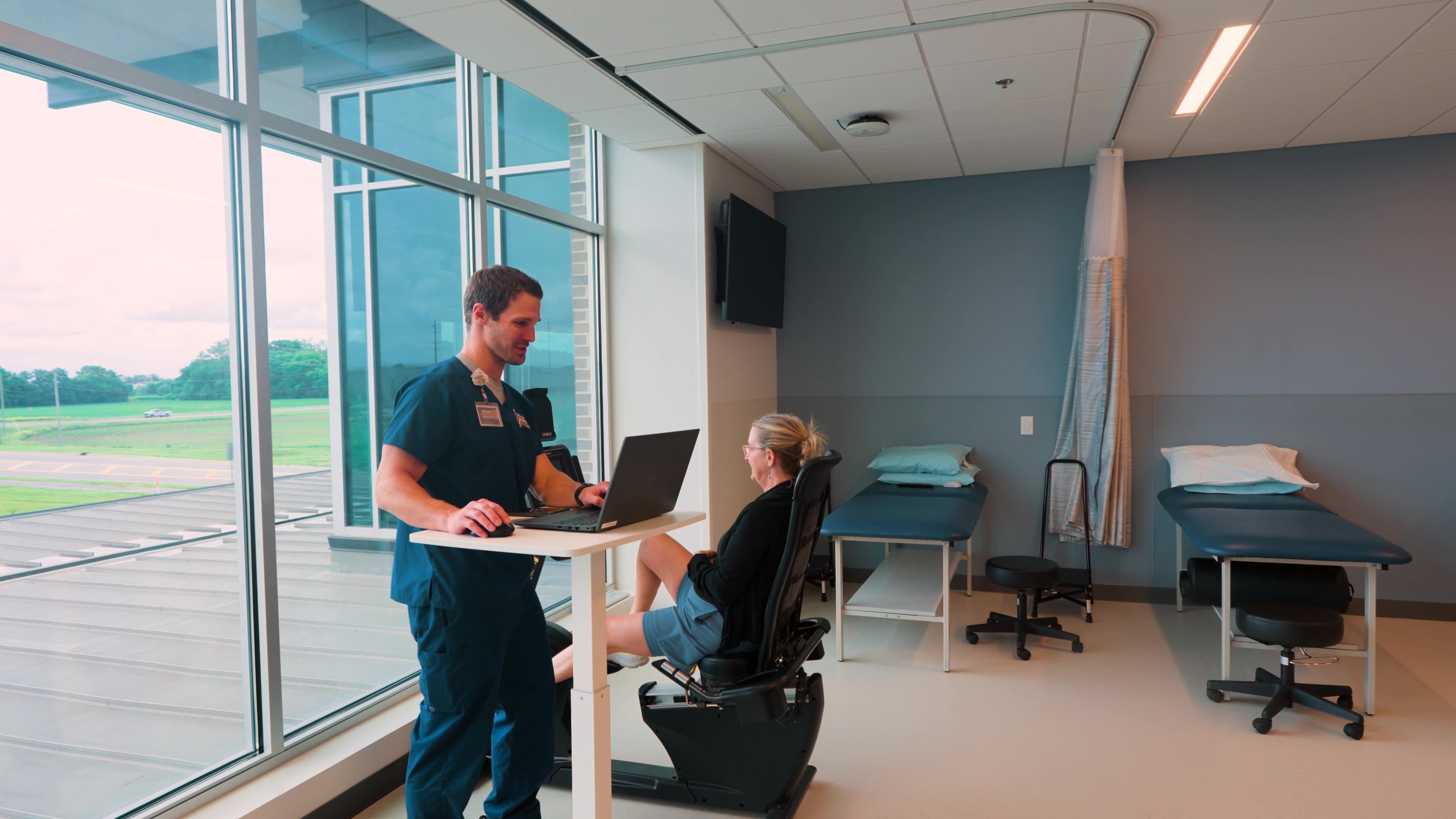 Indiana Orthopedic Institute exam room with a patient and care team member